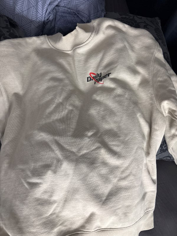 E kremuð peysa
