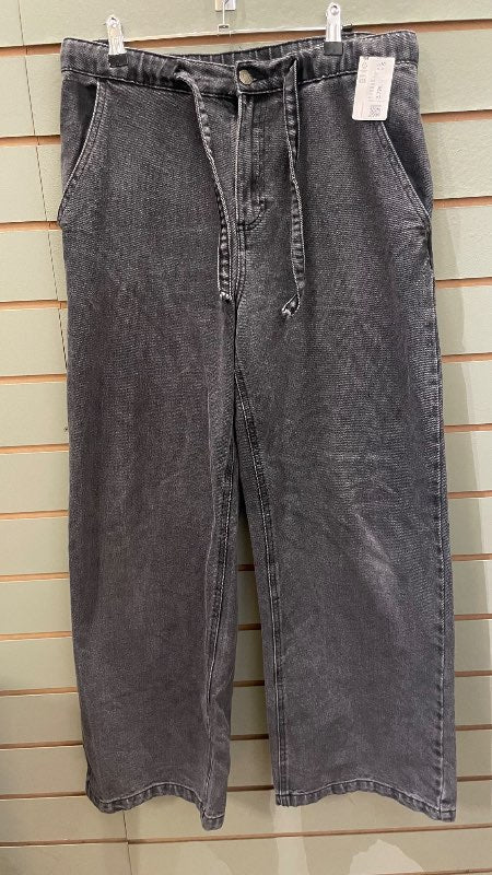 Gráar víðar gallabuxur
